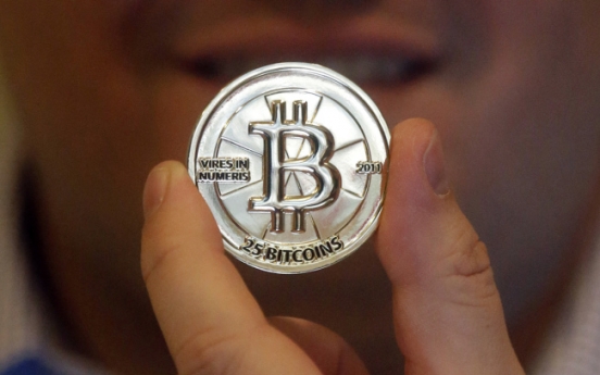 Bitcoin bursts: Hacker currency gets wild ride