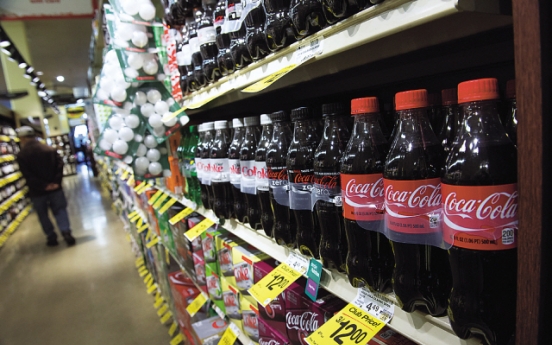 Coke goes global with anti-obesity push