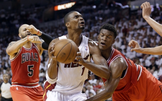 Heat rally past Bulls to advance, 94-91