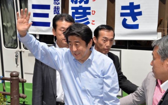 Abe hints at possible delay in tax hike