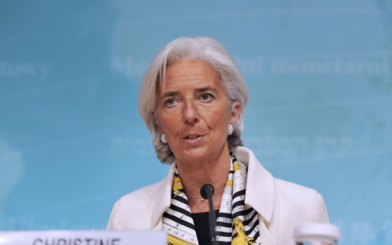 IMF assails U.S. budget cuts, lowers 2014 growth forecast