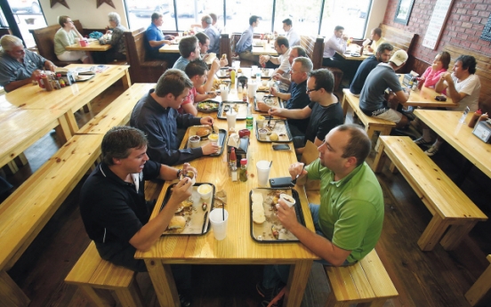 Conversations simmer at communal tables