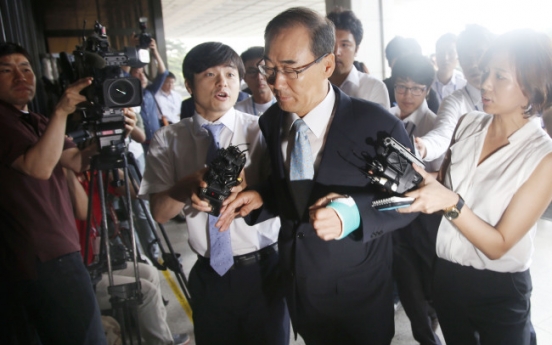 Former tax chief appears for questioning over bribery