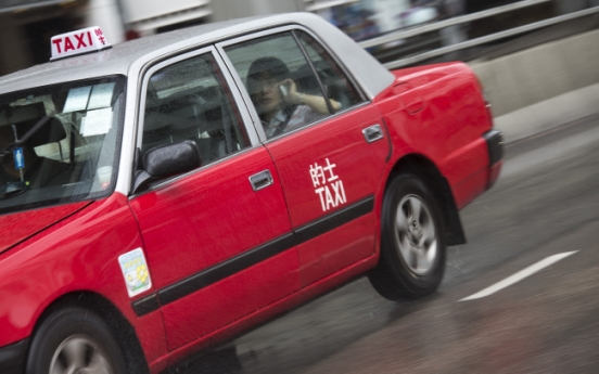 Investors turn H.K.’s red taxis into latest bubble market