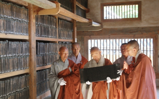 Bas relief statue of Buddha, Tripitaka Koreana blocks shown to the public