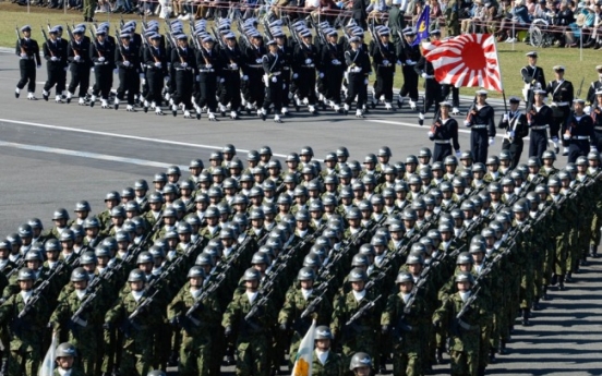 Japan’s push for collective self-defense stirs dispute