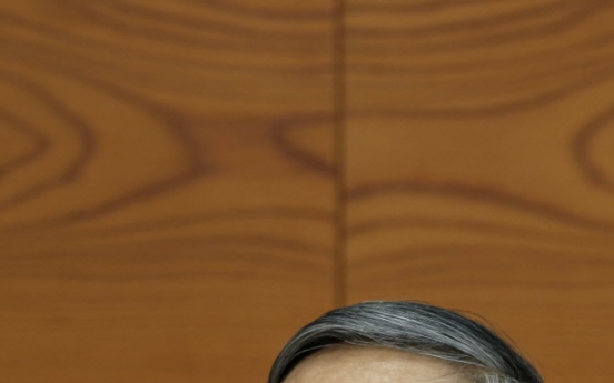 BOJ keeps loose money policy, says economy on mend