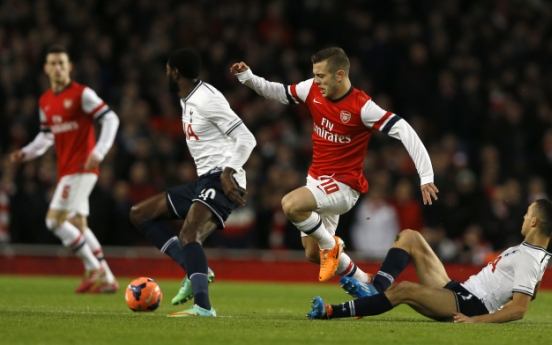 Arsenal sinks Spurs in cup, Blades fell Villa