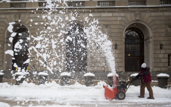 Cold weather slows economic growth