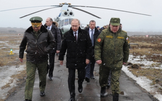 Putin ends military drills, but Crimea tension still high