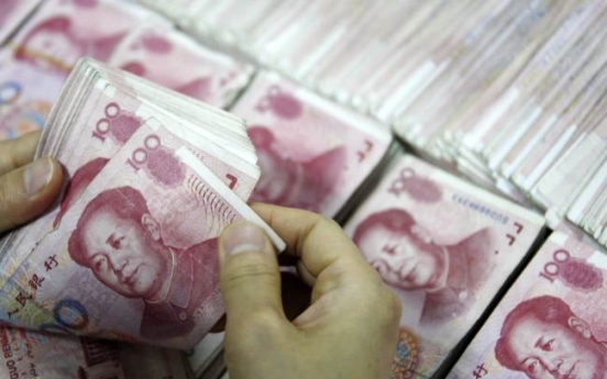 China doubles yuan trading band