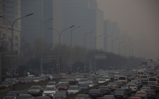 China’s smog splits families as firms pay for fresh air