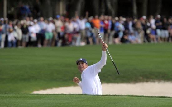 Kuchar chips in for RBC Heritage win