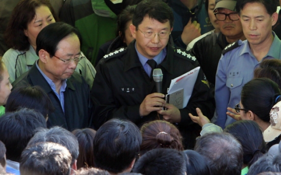 Families of ferry's lost confront Korean officials