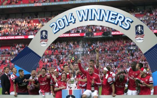 Arsenal ends 9-year title drought