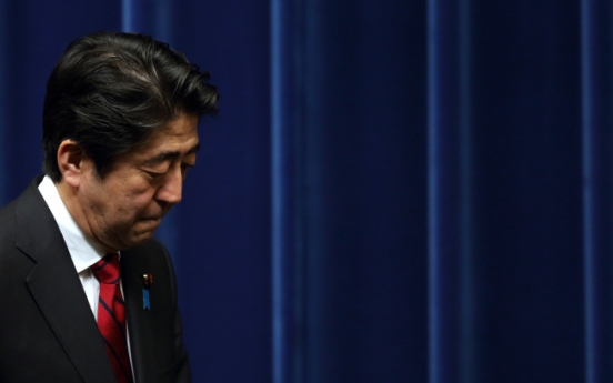 Abe fails to shake firms’ addiction to cash