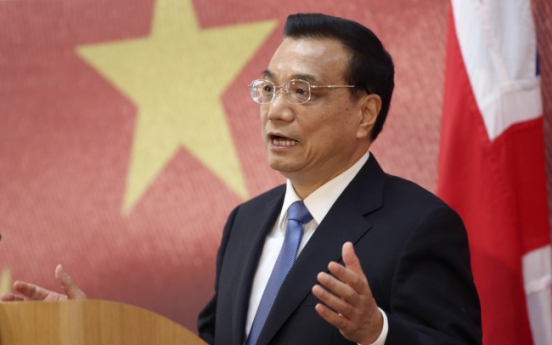 China will avoid hard landing while limiting stimulus, Li says