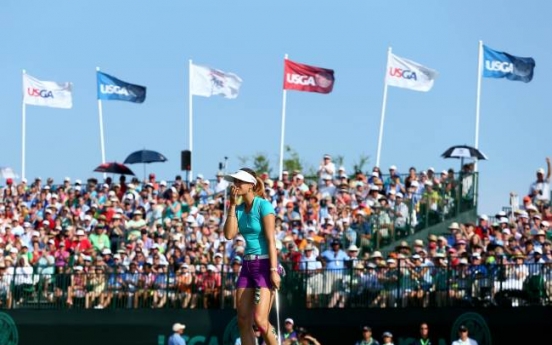 Wie holds on to win Women’s Open