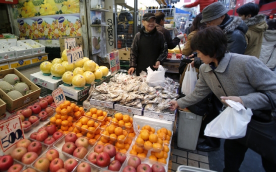 Abe declares end of deflation