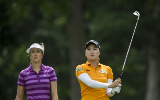 Wie leads rain-delayed Arkansas event