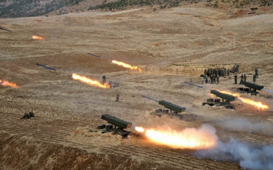 N. Korea fires 100 artillery shells into East Sea