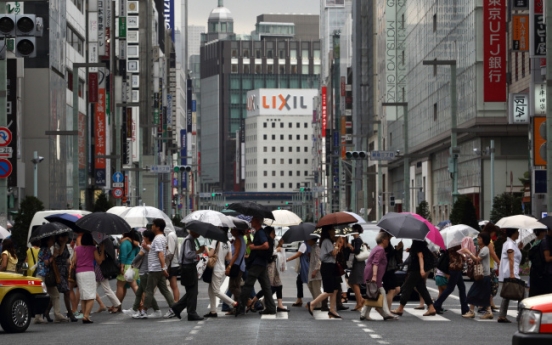 Japan’s economy shrinks on tax hike