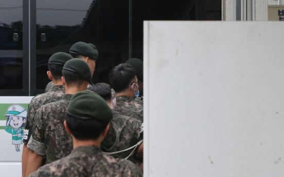 Prosecution files murder charges against 4 soldiers in abuse case