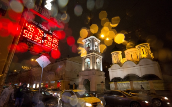 Ruble rebounds from brink but Russians wary