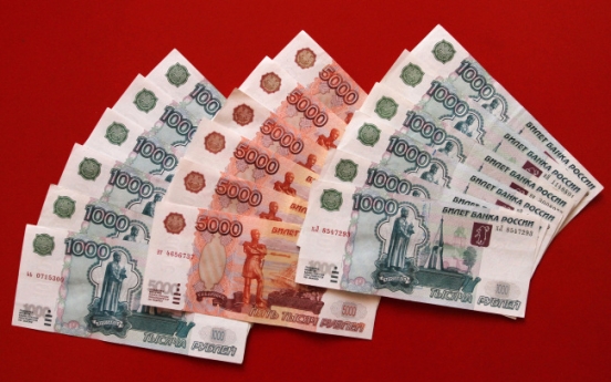 Western sanctions, ruble crash hit Russians hard