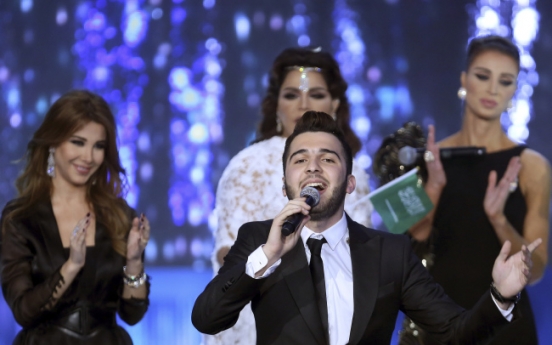 Syrian wins Arab song contest, keeps clear of politics