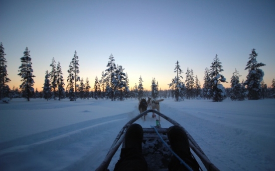 Basking under aurora-canvased winter skies of Finland