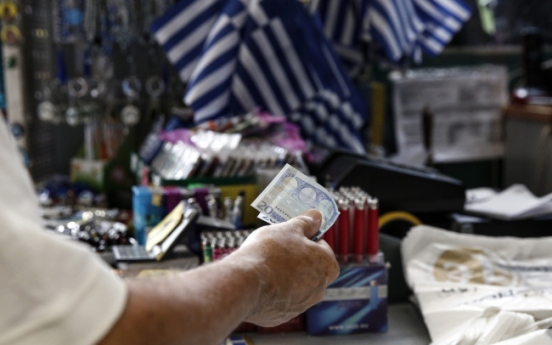 Greek bailout moves ahead after Germany gives its backing