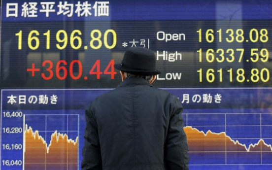 Tokyo stocks fall sharply by break on stronger yen, weaker oil