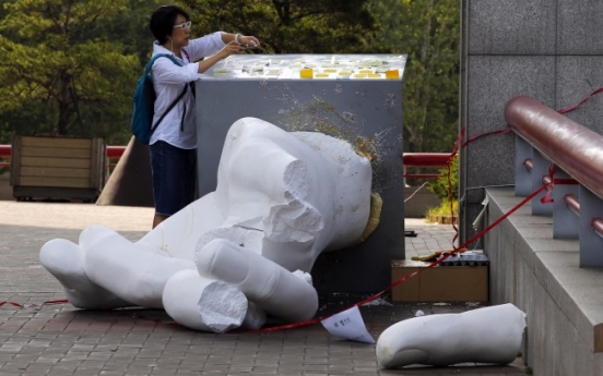 Three booked for destroying controversial sculpture