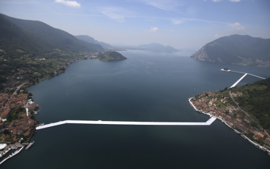 Artist Christo walks on water with “Floating Piers”