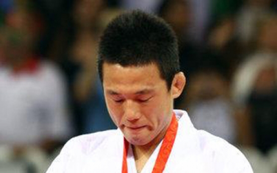 Former world judo champ Wang Ki-chun to retire