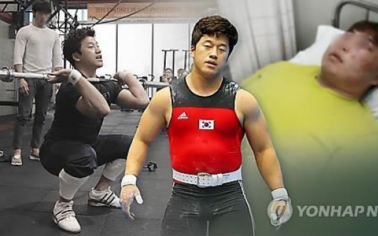 Olympic weightlifting champ ordered to pay fines for assault charges