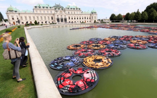 Ai Weiwei’s refugee life jackets in Vienna palace pond