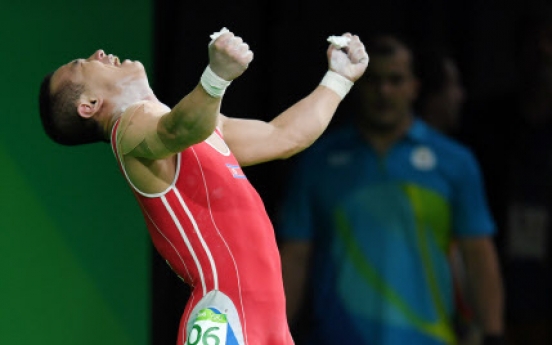 Weightlifter Om Yun-chol wins silver for North Korea's 1st medal in Rio