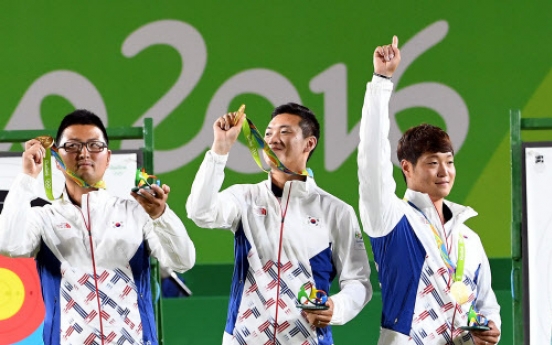 20-something friends team up for 1st Olympic gold in archery