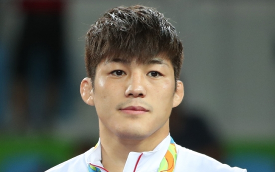 Korean wrestler Kim Hyeon-woo overcomes judging controversy to win bronze