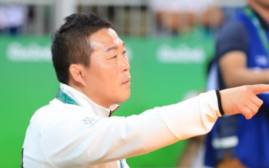 Banned Korean wrestling coach permitted back in seat