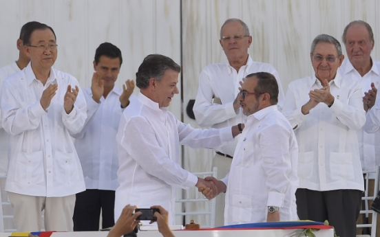 [Newsmaker] Santos, Timochenko: Colombia foes turned peacemakers