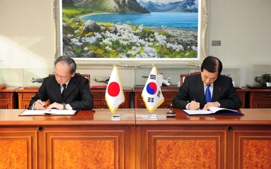 Korea, Japan sign pact to share military information