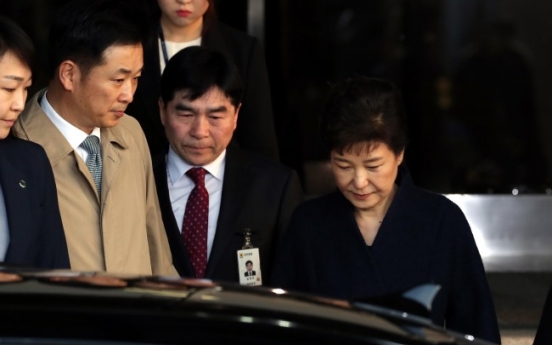 Ex-President Park heads back home after questioning over corruption scandal