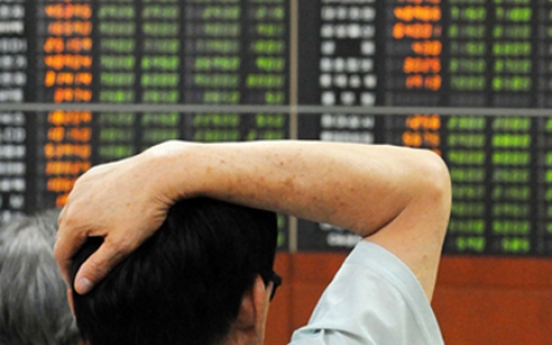 Seoul shares trade lower in late morning trade