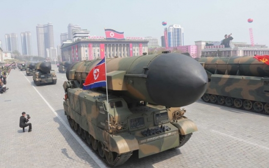 Man spotted in squatting pose in military parade