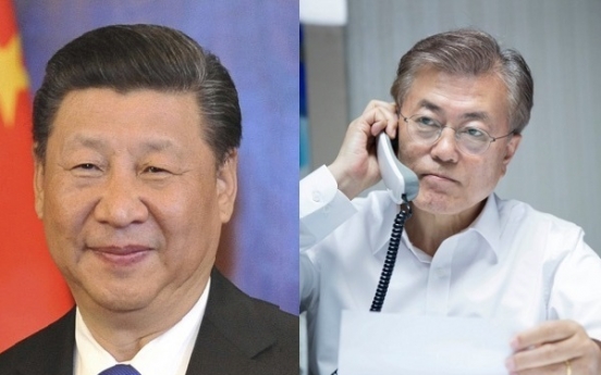 Moon and China's Xi agree to improve ties, denuclearize N. Korea