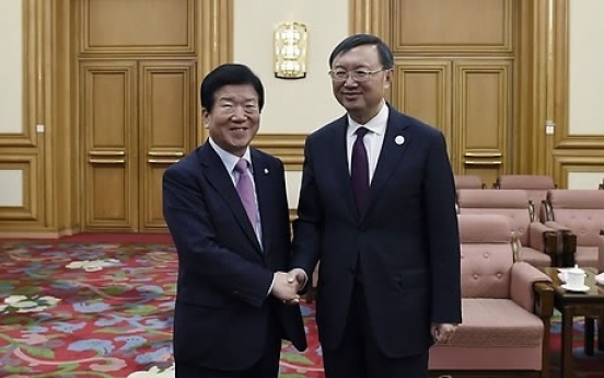 Chinese state councilor calls for efforts to recover ties with Korea under Moon admin.