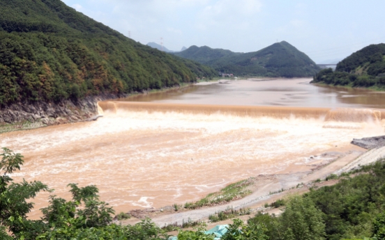 Heavy rain eases, typhoon slides past Jeju